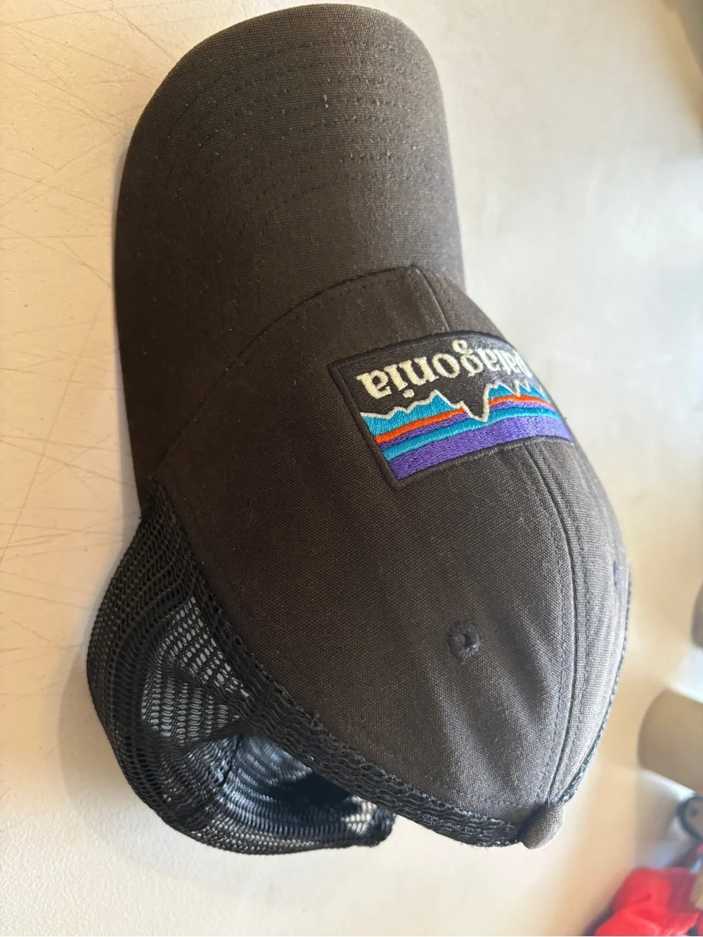 Patagonia  Black Trucker Hat with Blue, Purple, Teal and Orange Logo